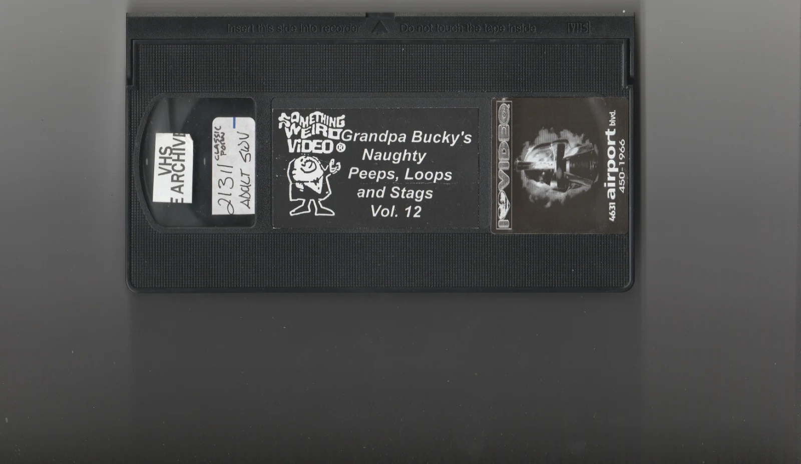 Grandpa Bucky's Naughty Triple XXX Stags, Loops, & Peeps VHS front label scan